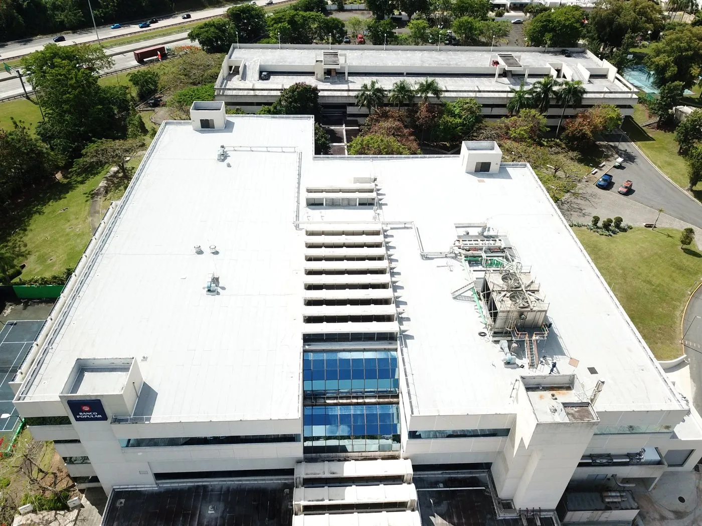 Banco Popular building with a finished white roof by Antilles Roofing