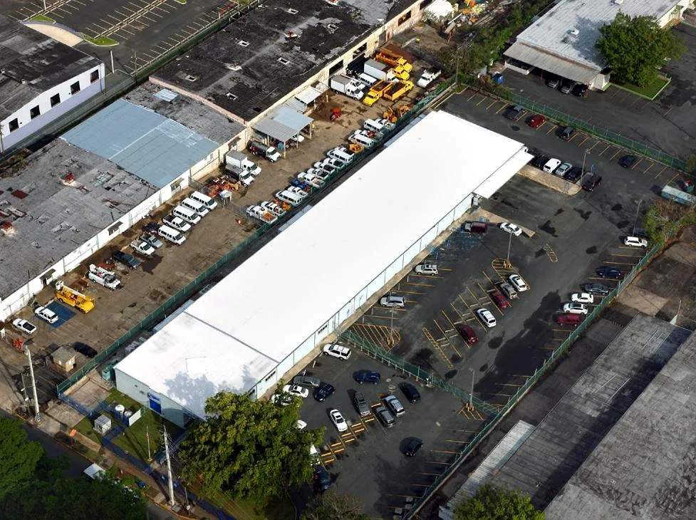 Aerial view of the US Postal Service Calaf Street facility with a new white roof